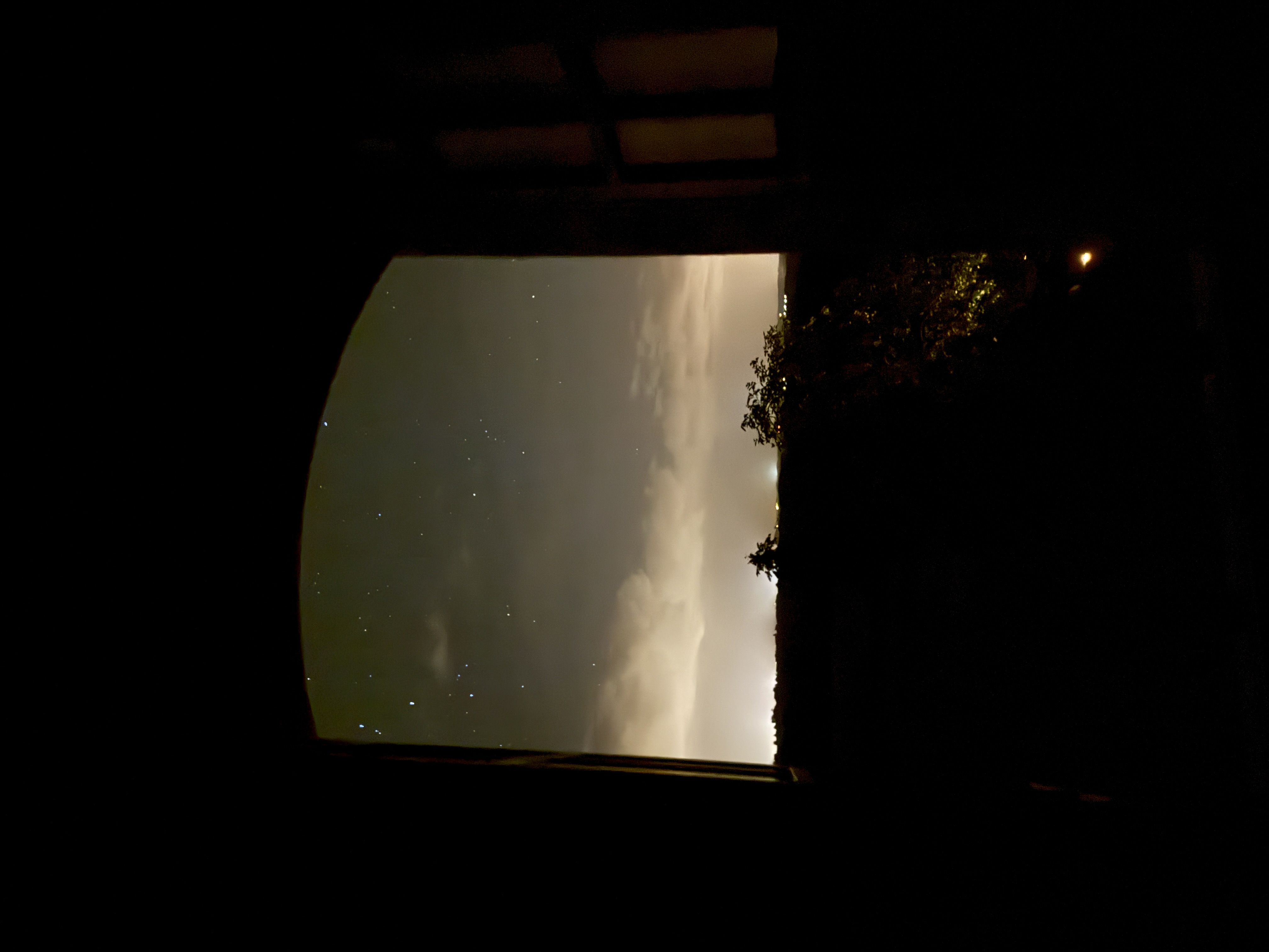 Stone arch framing the night sky