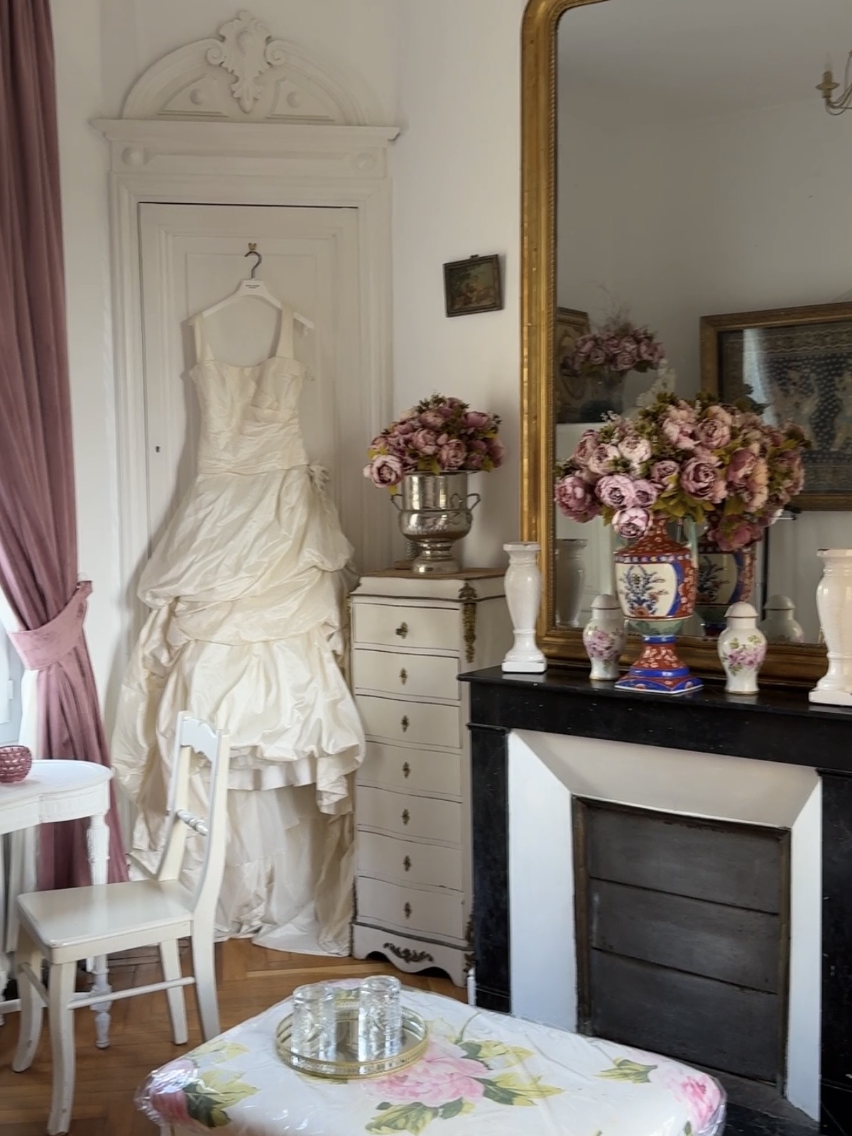 The bridal suite — the dress hanging by the fireplace