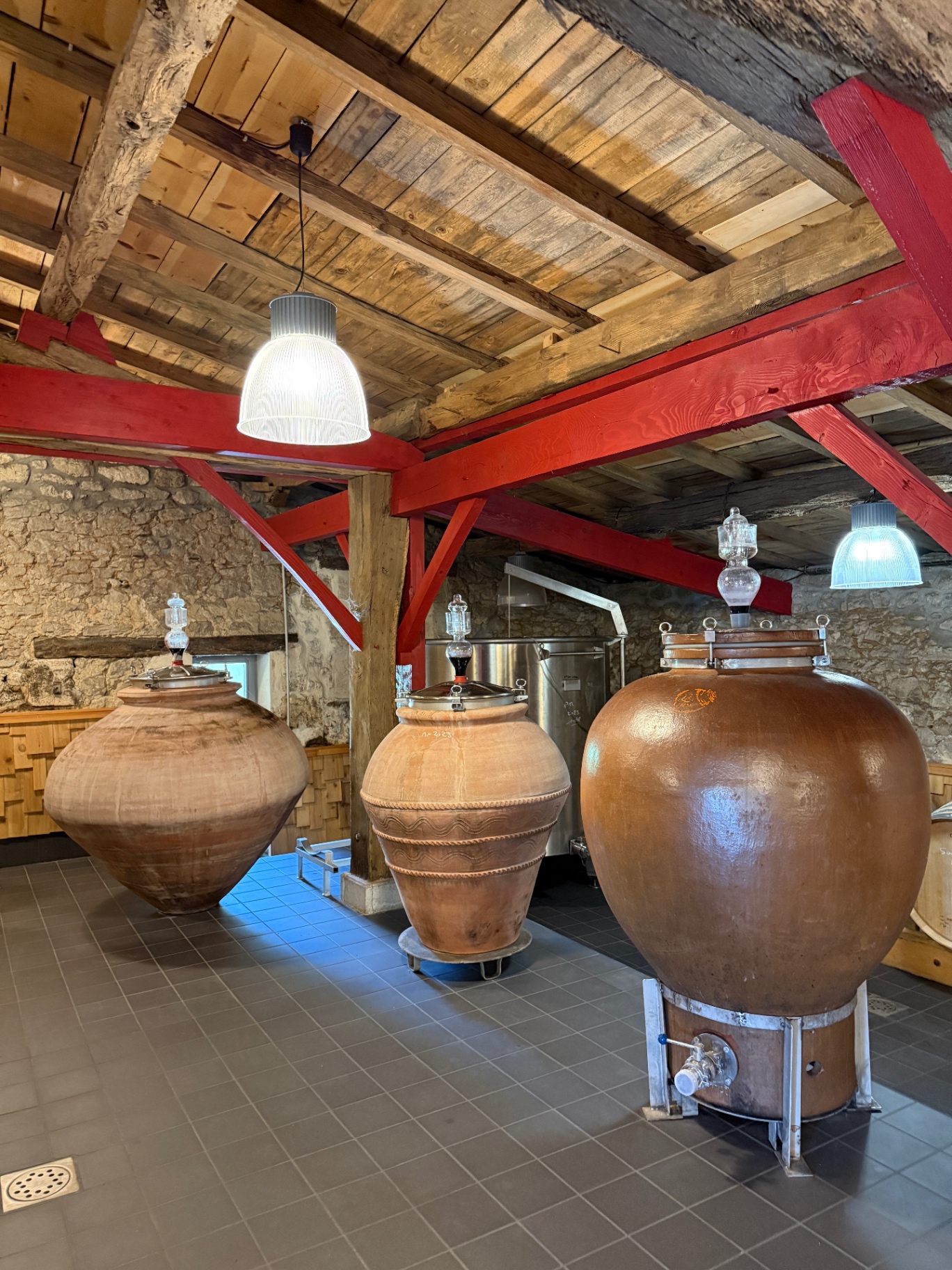 The wine chai with terracotta amphorae and red beams