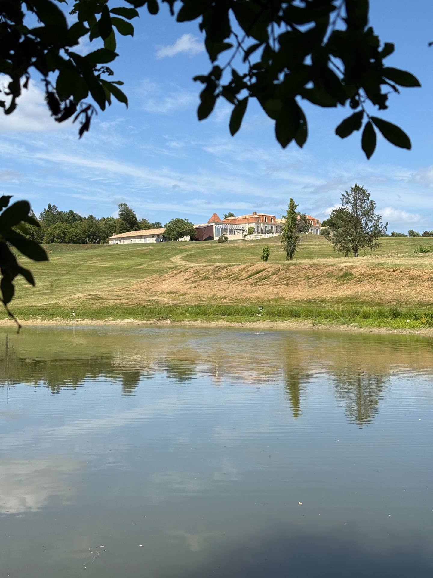 The château reflected in the estate lake